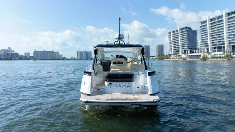 Slide: The Image of 2017 Beneteau Gran Turismo 40 yacht on water, city skyline in background. - 23
