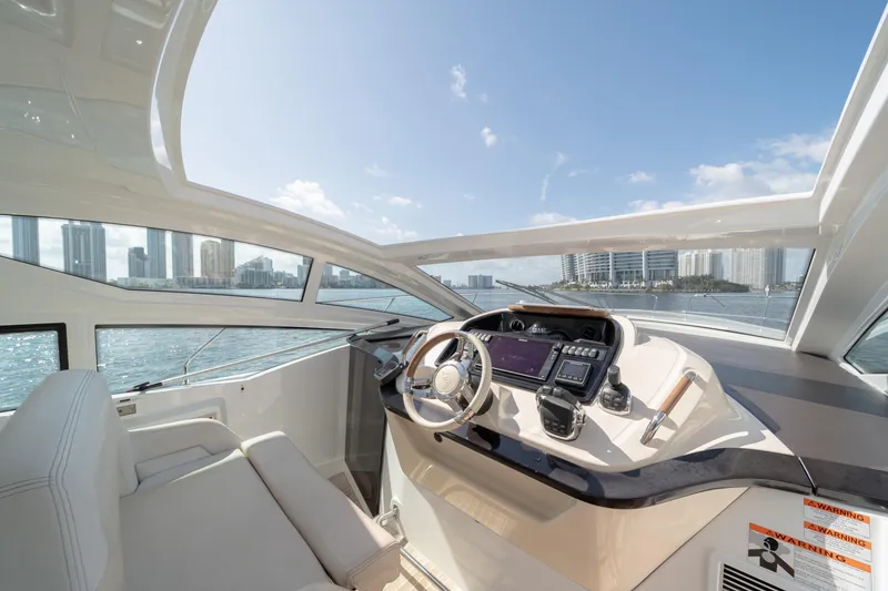 Slide: The Image of Interior view of 2017 Beneteau Gran Turismo 40 yacht cockpit with city skyline. - 7