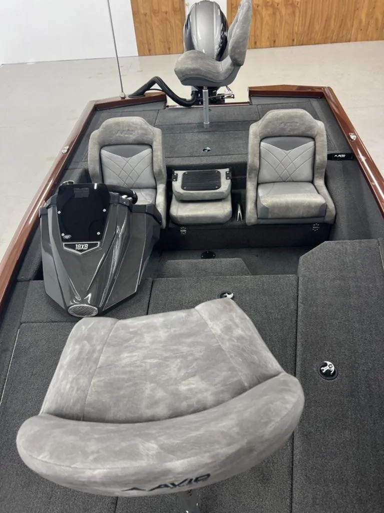 Slide: The Image of 2023 Avid 18XB boat interior with gray seating and console. - 10