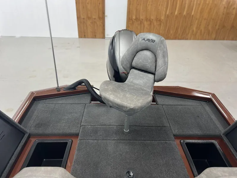 Slide: The Image of 2023 Avid 18XB boat interior with gray seating and storage compartments. - 12