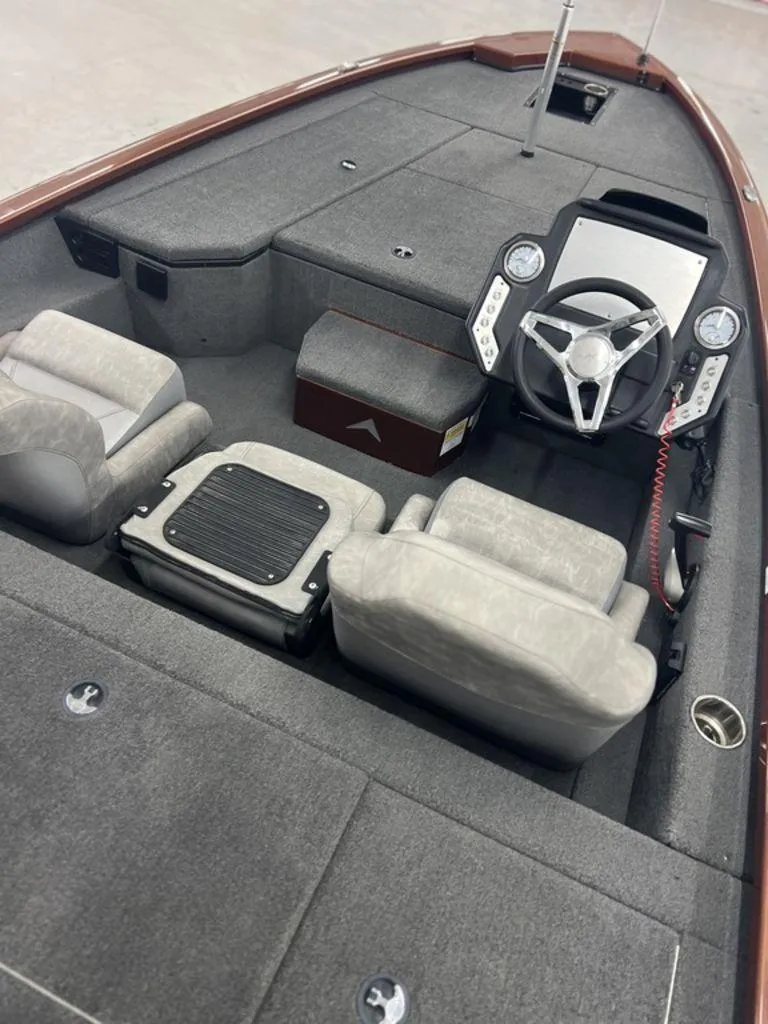 Slide: The Image of 2023 Avid 18XB boat interior with gray seating and modern dashboard. - 13