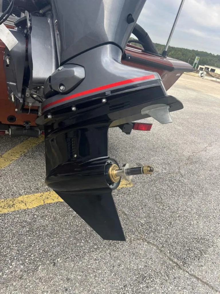 Slide: The Image of Close-up of a 2023 Avid 18XB boat motor on a parking lot. - 23