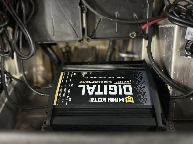 Slide: The Image of Avid 18XB 2023 boat with Minn Kota digital battery charger installed. - 29