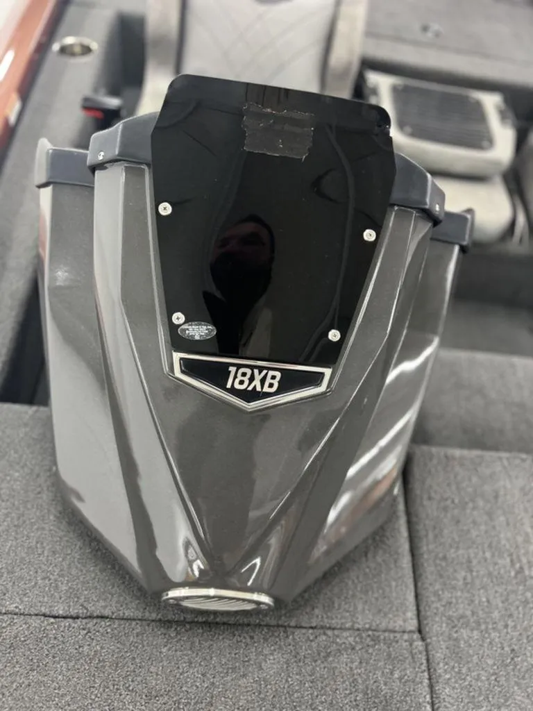 Slide: The Image of 2023 Avid 18XB boat console on gray carpeted surface. - 30