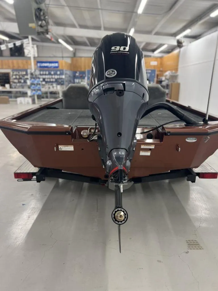 Slide: The Image of 2023 Avid 18XB boat with 90 horsepower engine in showroom. - 38