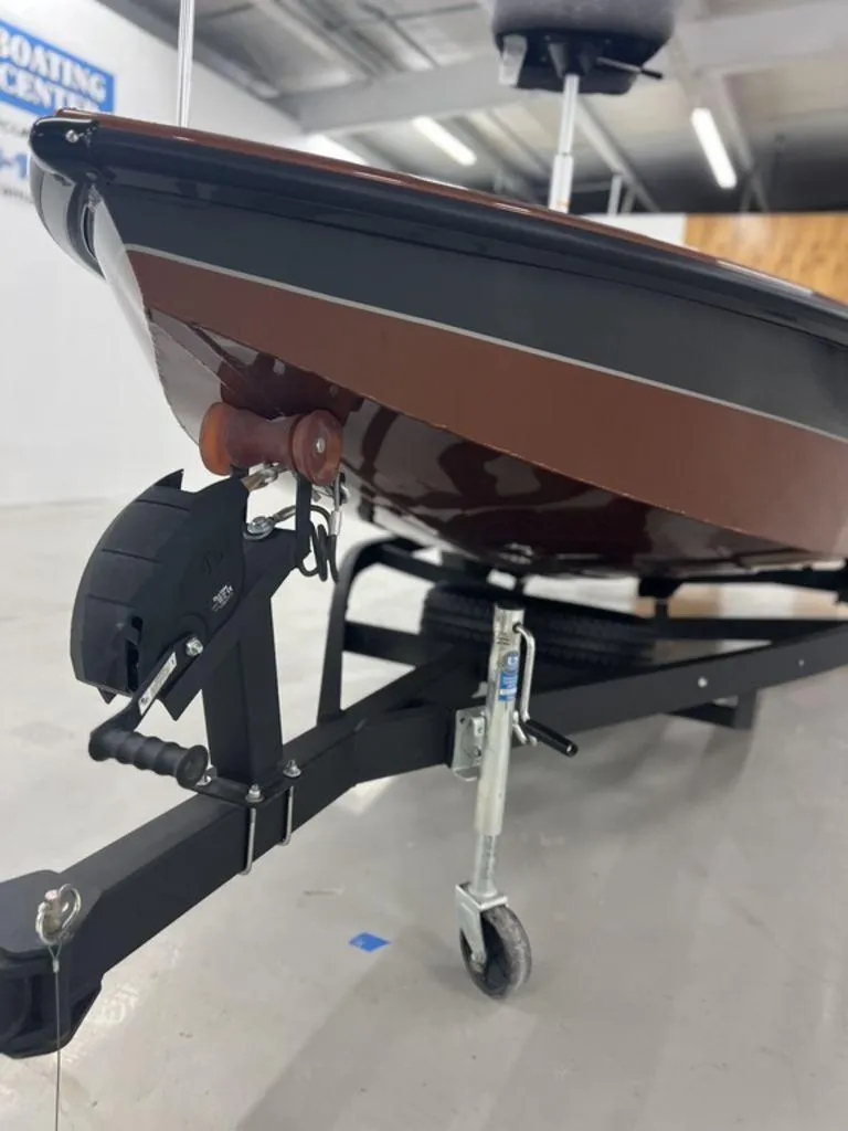 Slide: The Image of 2023 Avid 18XB boat on trailer in showroom. - 5