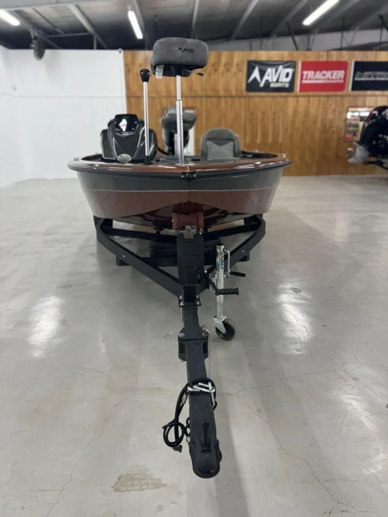 Slide: The Image of 2023 Avid 18XB boat on trailer in showroom. - 7