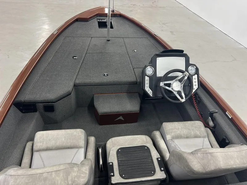 Slide: The Image of 2023 Avid 18XB boat interior with steering wheel and seating. - 8