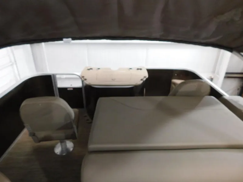 Slide: The Image of 2023 Bennington 20SSSP boat interior with seating and table. - 12