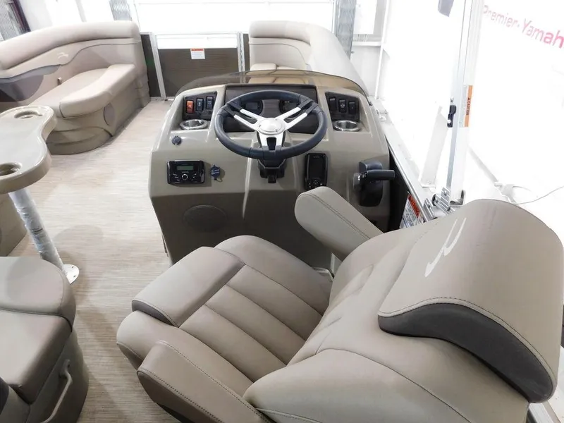 Slide: The Image of 2023 Bennington 20SSSP boat interior with steering console and seating. - 15