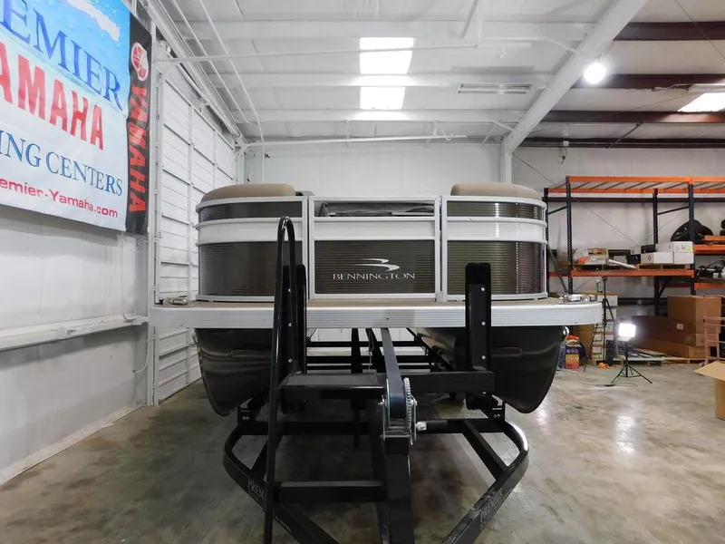 Slide: The Image of 2023 Bennington 20SSSP pontoon boat in showroom, front view. - 8