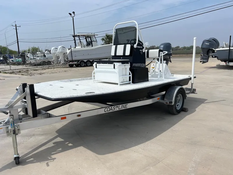 Slide: The Image of 2024 Freedom 14 CHIQUITA boat on trailer in outdoor lot. - 14