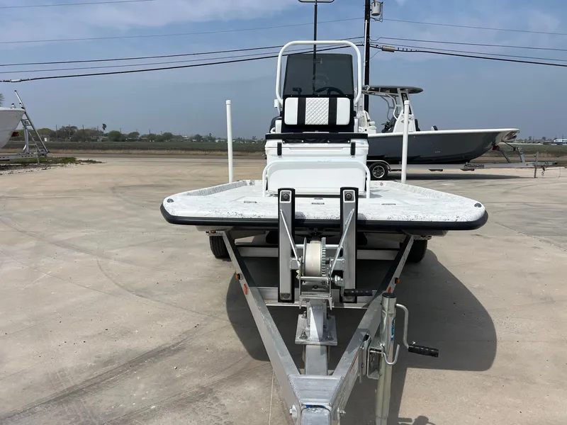 Slide: The Image of 2024 Freedom 14 CHIQUITA boat on trailer, parked outdoors on concrete surface. - 16