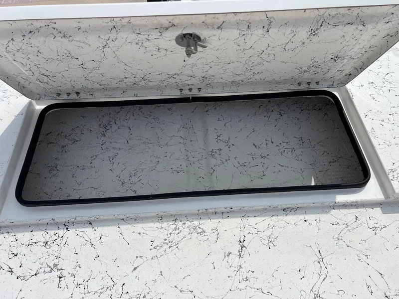 Slide: The Image of Open hatch on Freedom 14 CHIQUITA 2024 with marble-like interior design. - 26