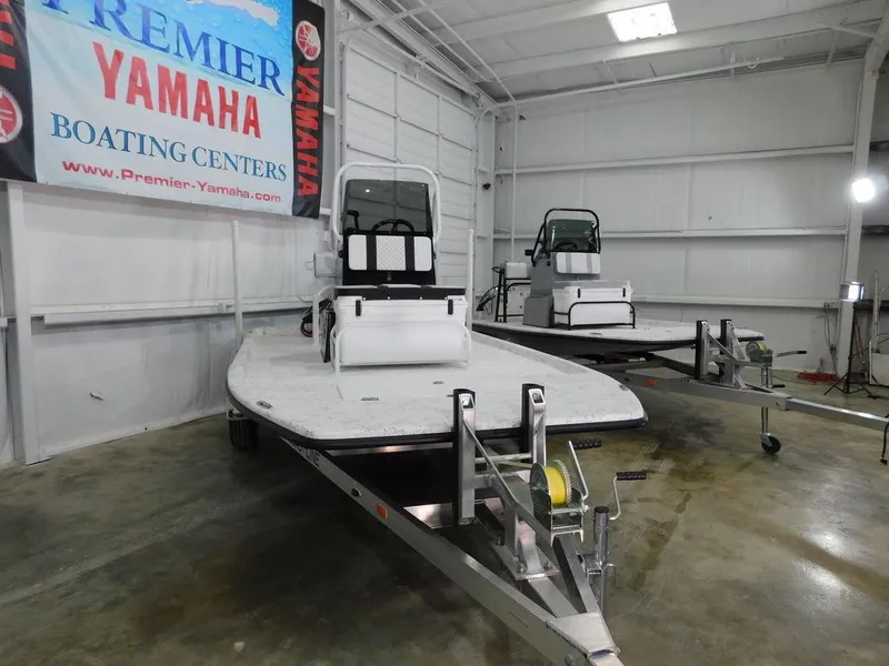 Slide: The Image of 2024 Freedom 14 CHIQUITA boats in Premier Yamaha showroom. - 3