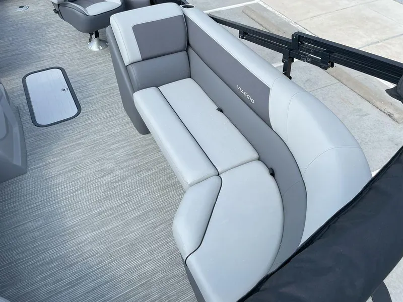 Slide: The Image of 2024 Viaggio V22U boat interior with gray seating and modern design. - 10