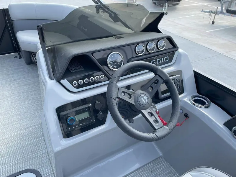 Slide: The Image of 2024 Viaggio V22U boat dashboard with steering wheel and control panel. - 14