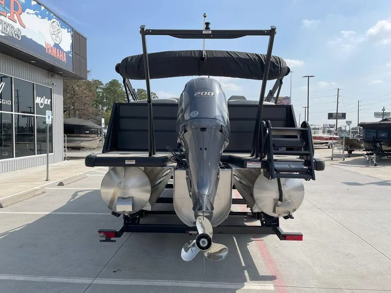 Slide: The Image of 2024 Viaggio V22U pontoon boat with Yamaha engine, parked at a dealership. - 5