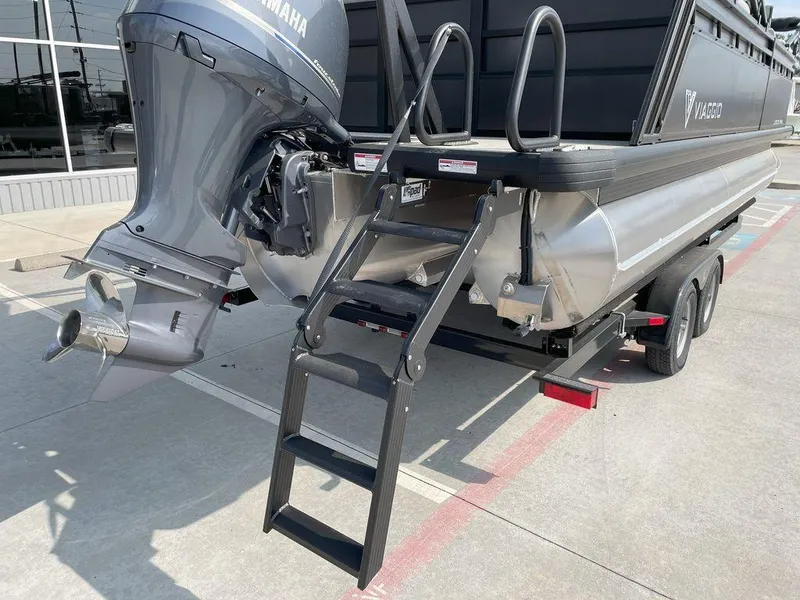 Slide: The Image of 2024 Viaggio V22U pontoon boat with Yamaha outboard motor and boarding ladder. - 6