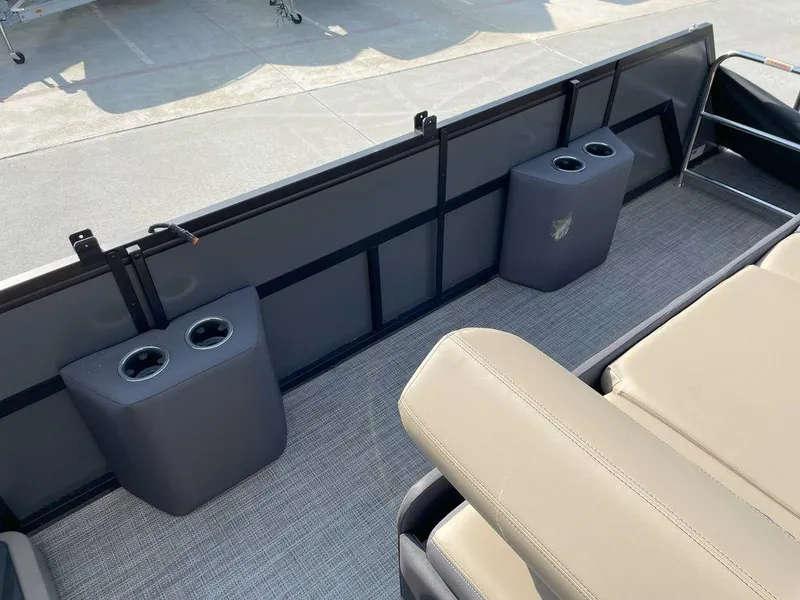 Slide: The Image of Interior of 2024 Viaggio Z22S boat with cup holders and beige seating. - 16