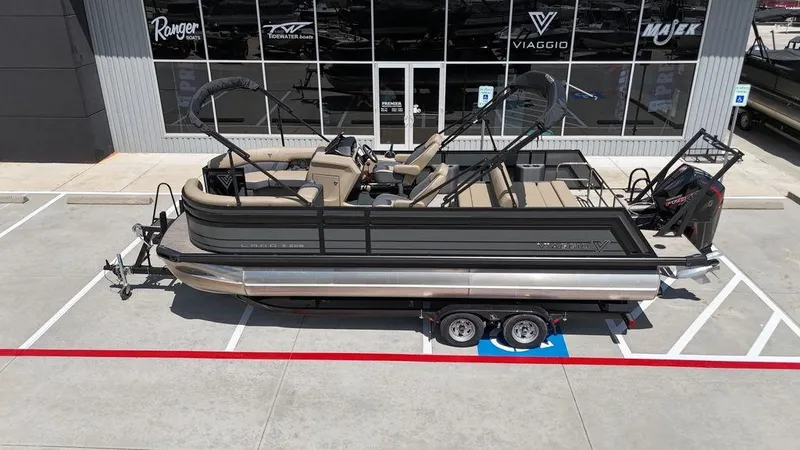 Slide: The Image of 2024 Viaggio Z22S pontoon boat on trailer outside dealership. - 20