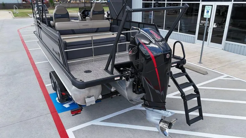 Slide: The Image of 2024 Viaggio Z22S pontoon boat with powerful outboard motor, parked in a lot. - 33