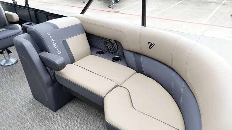 Slide: The Image of 2024 Viaggio Z22S boat interior with beige and gray seating, cup holders, and speaker. - 35