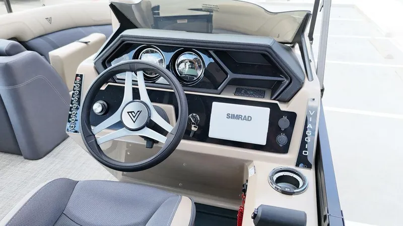 Slide: The Image of 2024 Viaggio Z22S boat dashboard with steering wheel and Simrad display. - 39