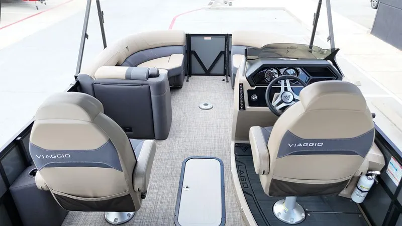 Slide: The Image of 2024 Viaggio Z22S boat interior with plush seating and modern dashboard. - 42