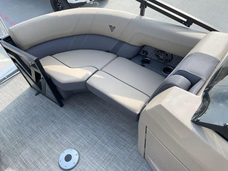 Slide: The Image of 2024 Viaggio Z22S boat interior with beige seating and cup holders. - 7