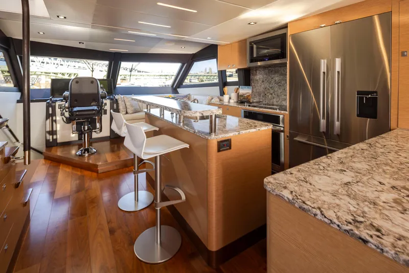 Slide: The Image of Luxurious interior of 2020 Ocean Alexander 70E Motoryacht with modern kitchen and helm station. - 11