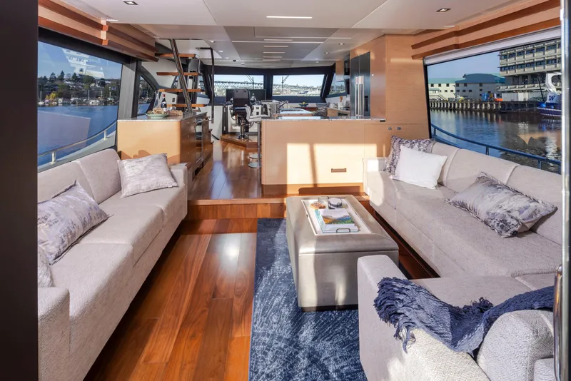Slide: The Image of Luxurious interior of 2020 Ocean Alexander 70E Motoryacht with elegant seating and panoramic windows. - 12