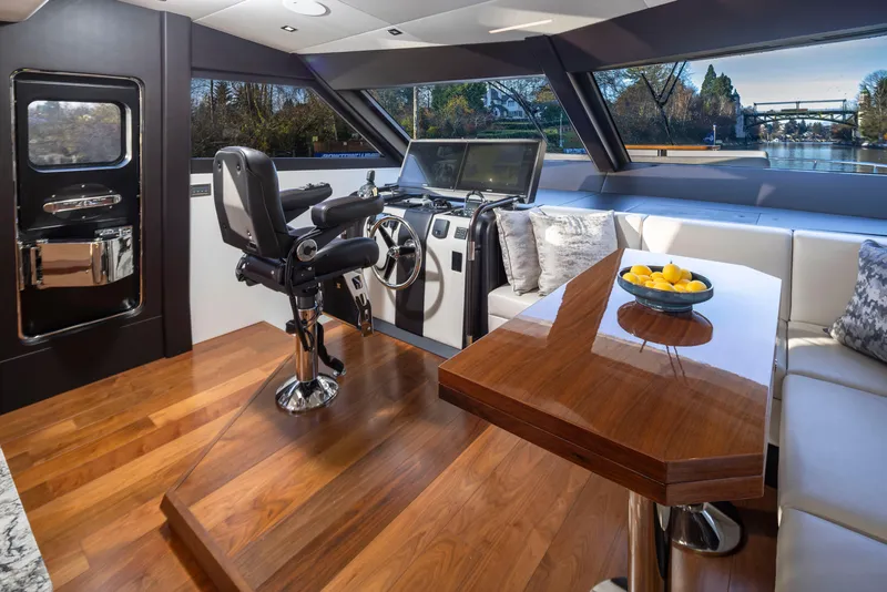 Slide: The Image of Luxurious interior of 2020 Ocean Alexander 70E Motoryacht with helm and seating area. - 15