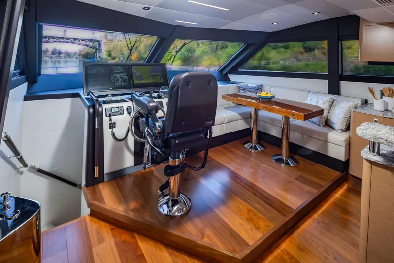 Slide: The Image of Luxurious interior of 2020 Ocean Alexander 70E Motoryacht with helm and seating area. - 17