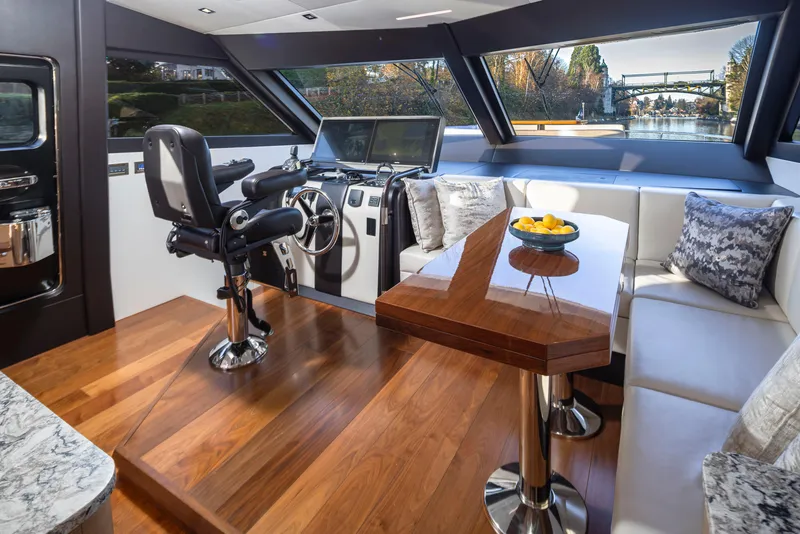 Slide: The Image of Luxurious interior of 2020 Ocean Alexander 70E Motoryacht with helm and seating area. - 18