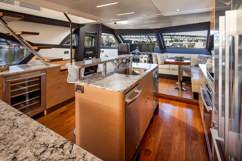 Slide: The Image of Luxurious interior of 2020 Ocean Alexander 70E Motoryacht with modern kitchen and dining area. - 21