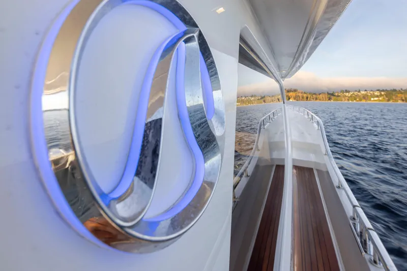 Slide: The Image of 2020 Ocean Alexander 70E Motoryacht, sleek design, cruising on open water. - 23