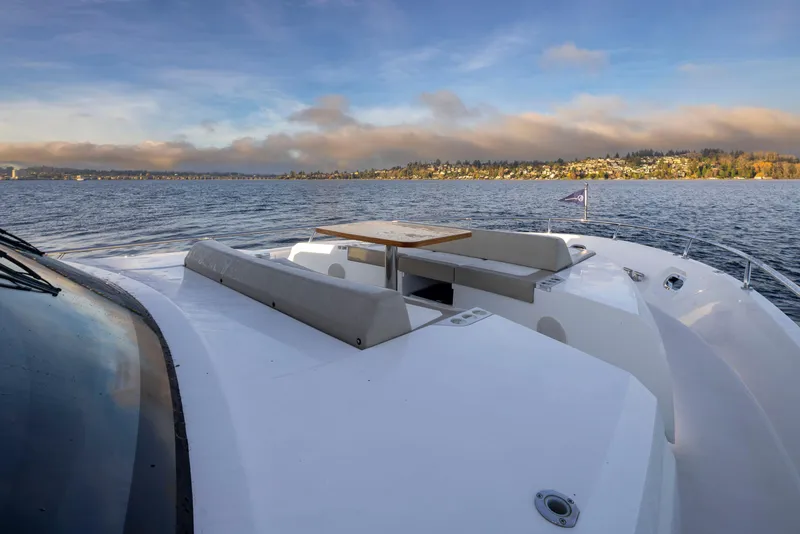 Slide: The Image of Ocean Alexander 70E Motoryacht 2020 on serene water with scenic backdrop. - 24