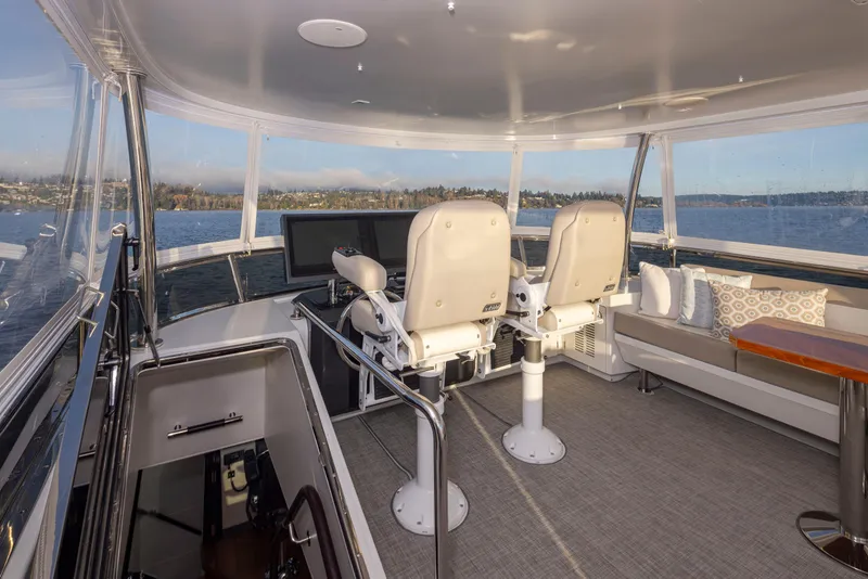 Slide: The Image of Luxurious 2020 Ocean Alexander 70E Motoryacht helm with panoramic views and plush seating. - 27