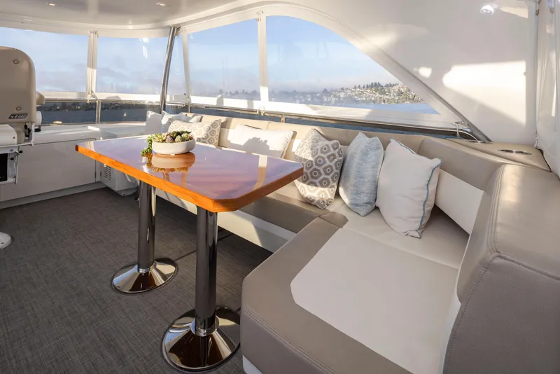 Slide: The Image of Luxurious interior of 2020 Ocean Alexander 70E Motoryacht with elegant seating and table. - 35