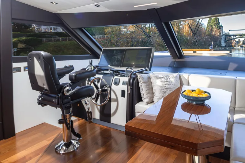 Slide: The Image of Luxurious interior of 2020 Ocean Alexander 70E Motoryacht with helm, seating, and table. - 36