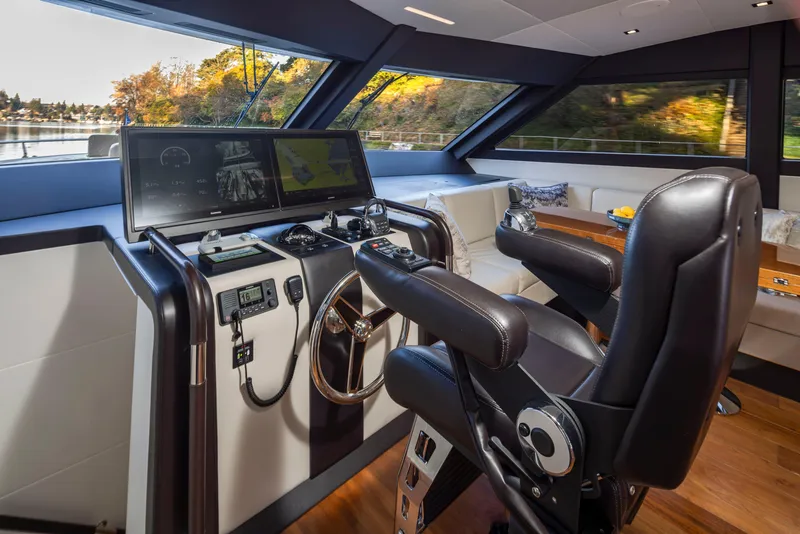 Slide: The Image of Luxurious helm of 2020 Ocean Alexander 70E Motoryacht with modern controls and panoramic view. - 37