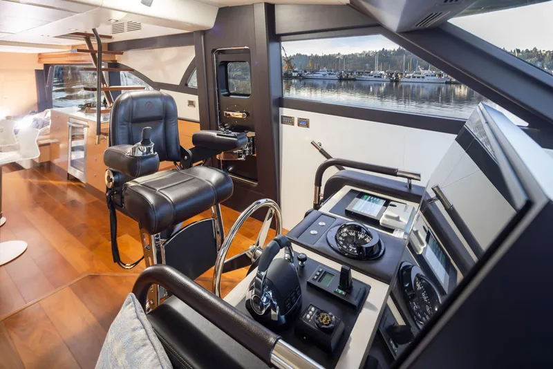 Slide: The Image of Luxurious helm of 2020 Ocean Alexander 70E Motoryacht with modern controls and panoramic view. - 39