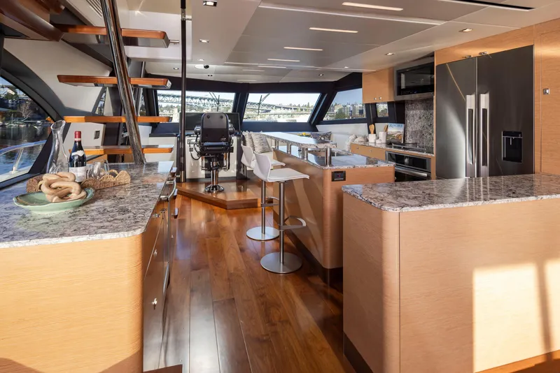 Slide: The Image of Luxurious interior of 2020 Ocean Alexander 70E Motoryacht with modern kitchen and seating area. - 43
