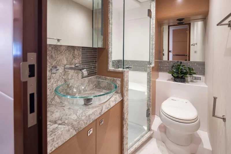 Slide: The Image of Luxurious bathroom in 2020 Ocean Alexander 70E Motoryacht with glass sink and modern fixtures. - 45