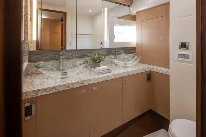 Slide: The Image of Luxurious bathroom in 2020 Ocean Alexander 70E Motoryacht with dual glass sinks and modern fixtures. - 49