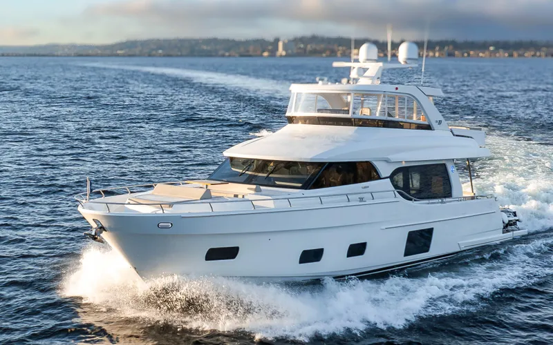 Slide: The Image of 2020 Ocean Alexander 70E Motoryacht cruising on open water. - 8