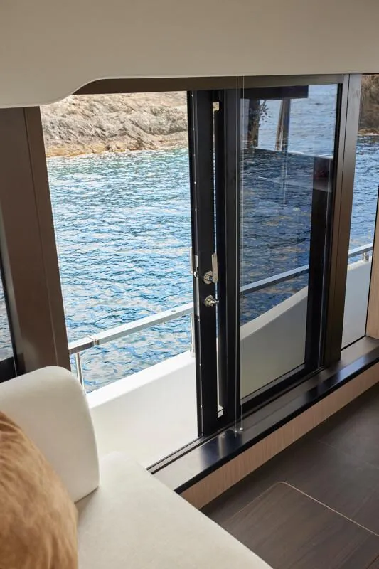 Slide: The Image of Interior view of 2026 Prestige F5.7 yacht with ocean backdrop. - 18