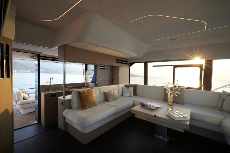 Slide: The Image of Luxurious interior of 2026 Prestige F5.7 yacht with elegant seating and ocean view. - 19