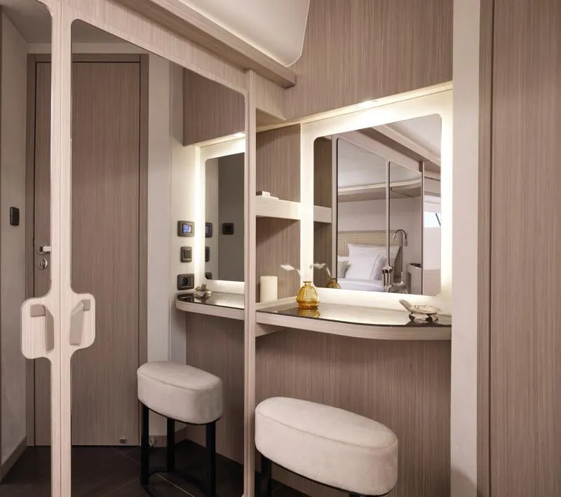 Slide: The Image of Luxurious interior of 2026 Prestige F5.7 yacht with vanity and seating. - 25